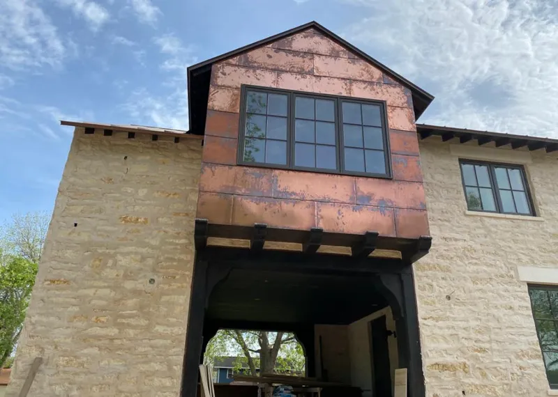 Copper metal panel facade on a stone building for Metal Roof Coating in Pimmit Hills